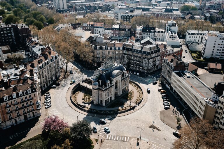An aerial shot of a cityscape with a lot of cars and beautiful buildings in Lille, France