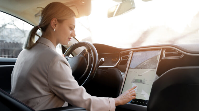 person-taking-care-electric-car